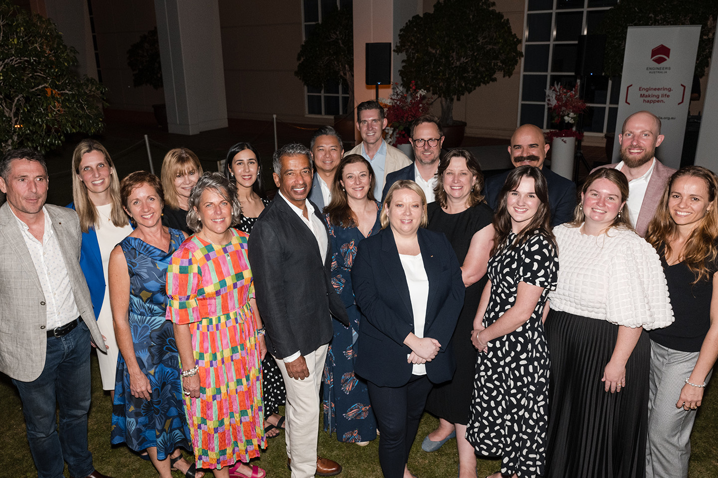 Large group of people dressed in formal clothing 