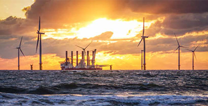 Boast and wind turbines in ocean