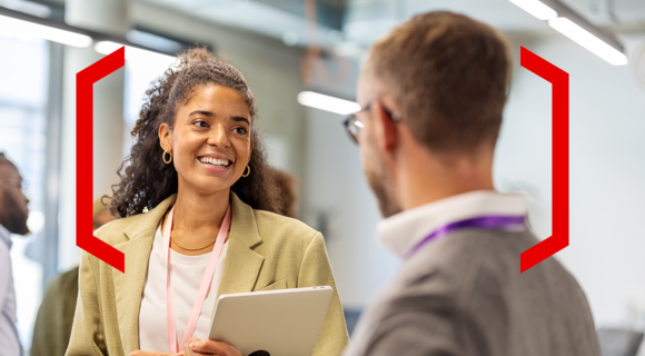 Image of a woman looking at a man who id faced away from camera